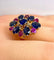 54 Importante bague or jaune, 7 saphirs et 6 rubis 58 Facettes AB454