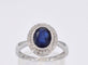 Bague 54 Bague entourage en or blanc avec diamants et saphir 58 Facettes 2044