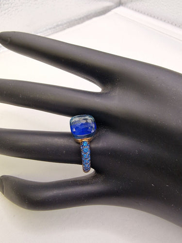Bague 53 POMELLATO - Bague NUDO Classic deux ors, topaze et saphirs 58 Facettes