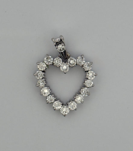 Pendentif Pendentif ancien cœur ajouré serti de diamants 58 Facettes