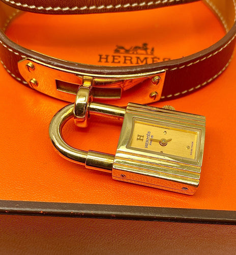 Montre Montre Hermès «  Kelly », cadran PM plaqué or, double tour cuir marron 58 Facettes AB453