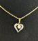 Pendentif Pendentif coeur 2 ors diamants et perle 58 Facettes LP425