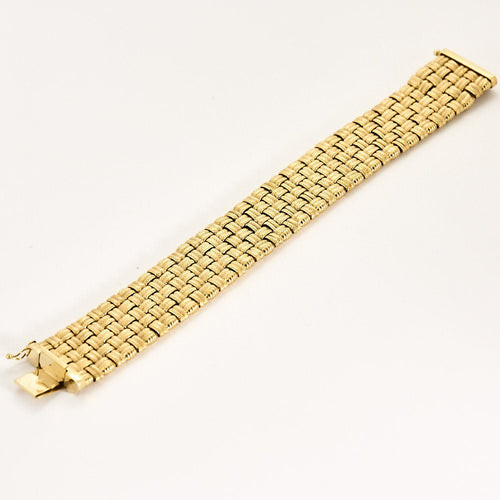 Bracelet Large bracelet tressé en or jaune 58 Facettes LOR3435
