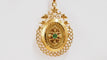 Pendentif Pendentif porte photo en or jaune et émeraude 58 Facettes 32604