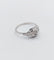Bague 53 Bague art deco or blanc 18k ornée d'un diamant rond dans une monture géométrique finement travaillée (circa 1930) 58 Facettes A04979