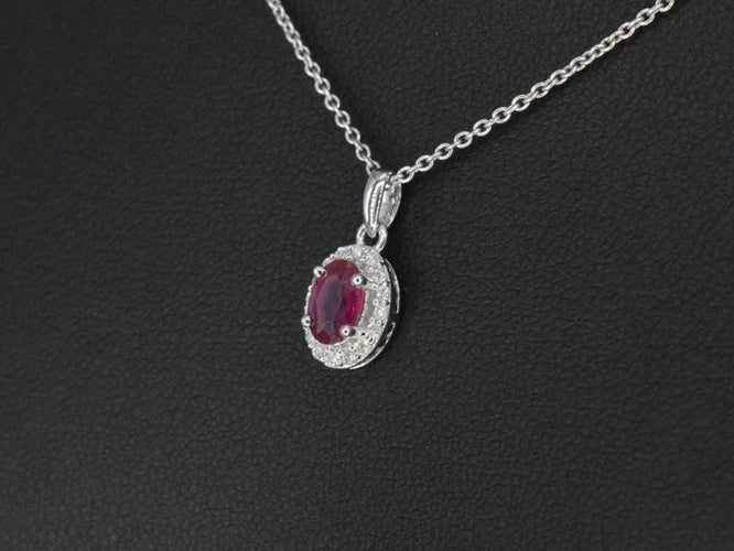 Pendentif Pendentif en or blanc serti de diamants et de rubis 58 Facettes 2017