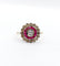 Bague fleur art deco or rose 18k ornée d'un diamant taille brillant entouré de rubis calibrés dans une monture finement travaillée (circa 1920)