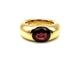 Bague 51 CARTIER. Collection "Ellipse", bague or jaune et grenat 58 Facettes