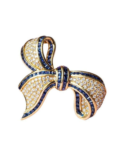 Broche Broche nœud composée d'or jaune saphirs et diamants 58 Facettes