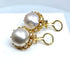 Bague 52 Bague et boucles d’oreilles en or jaune 18 carats et perles mabé. 58 Facettes AB309