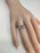 Bague 53.5 Bague pierre bleue ovale entourage de diamants en or gris 18k 58 Facettes LP1800