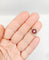 Bague 48 Bague fleur art deco or rose 18k ornée d'un diamant taille brillant entouré de rubis calibrés dans une monture finement travaillée (circa 1920) 58 Facettes A04432