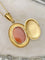 Pendentif Pendentif porte-photo en or jaune serti d'un camée en Agate 58 Facettes
