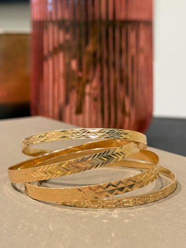 Bracelet 4 Bracelets joncs ciselés en or jaune 58 Facettes 1.0001394/2