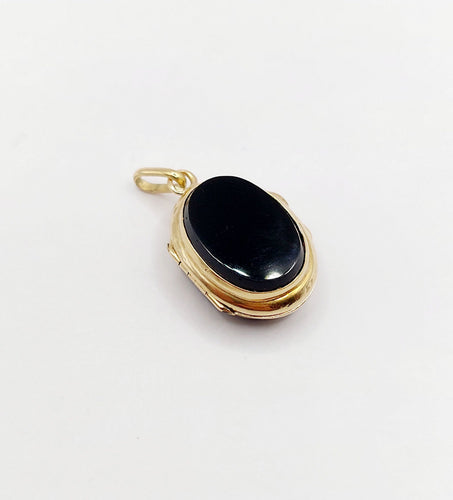 Pendentif Pendentif porte-photo or jaune et onyx (circa 1900) 58 Facettes A05916