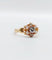 Bague marguerite antique or rose ornée d'un diamant entouré de diamant et épaulé de petits cœurs