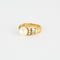 Bague 52 Bague or jaune, perle blanche et diamants 58 Facettes 240787