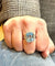 Bague 56 Bague or blanc topaze bleue et diamants 58 Facettes