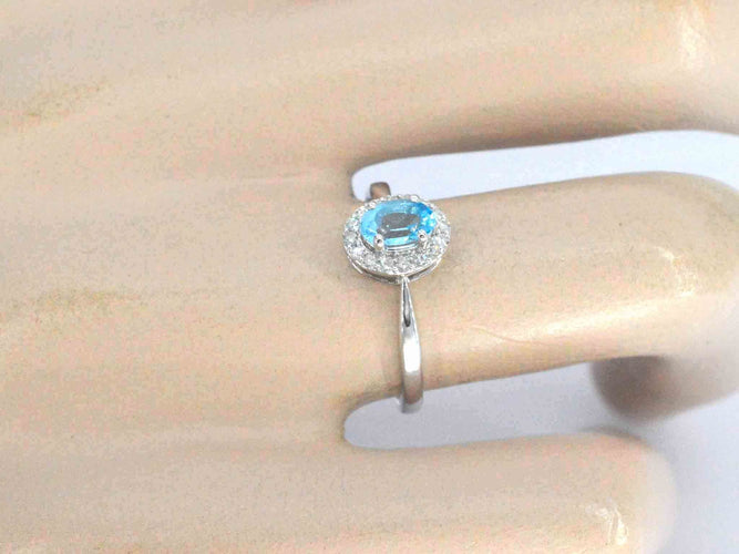 White gold ring with a blue topaz and natural diamonds 58 Facettes 2367
