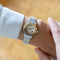 Montre Cartier - Montre Santos Octagone cadran crème chiffres romains acier et or jaune 58 Facettes