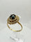 Bague 59 Bague en or jaune sertie d'un saphir bleu foncé et d'un halo de diamants. 58 Facettes 50355