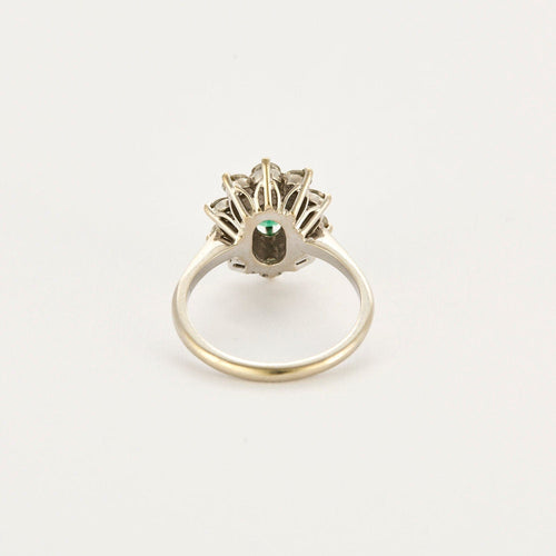 Bague 55 Bague Marguerite or gris et jaune, diamants et émeraude 58 Facettes 250256
