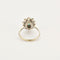Bague 55 Bague Marguerite or gris et jaune, diamants et émeraude 58 Facettes 250256