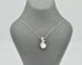 Collier Collier en or blanc avec perle et diamants 58 Facettes 10852