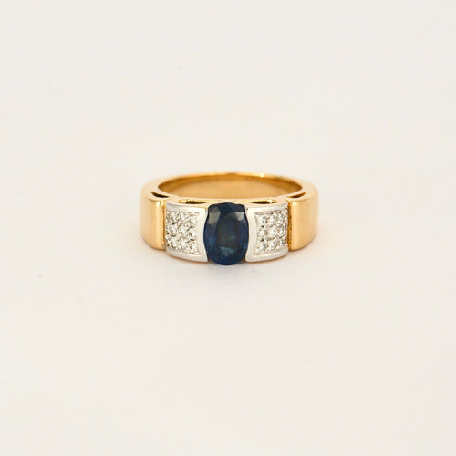 Bague 57 Bague jonc or jaune et gris, centrée d'un saphir 58 Facettes