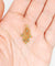 Pendentif Pendentif vintage or jaune Main de fatma orné de turquoises (circa 1950) 58 Facettes A04727