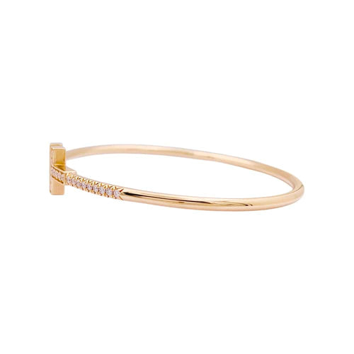 Bracelet Bracelet Tiffany "Wire Tiffany T" en or rose et diamants. 58 Facettes 34827