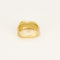 Bague en or jaune à motif de noeud stylisée