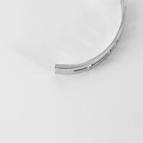 Bracelet DINH VAN - Pulse - Bracelet or blanc et diamants 58 Facettes MEA43043