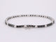 Bracelet Bracelet de tennis en or blanc serti de diamants noirs et blancs 58 Facettes 2119