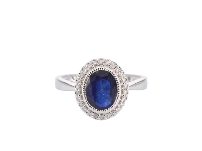 Bague 54 Bague entourage en or blanc avec diamants et saphir 58 Facettes 2044