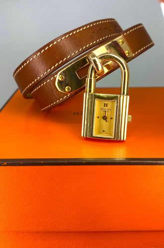 Montre Hermès «  Kelly », cadran PM plaqué or, double tour cuir marron