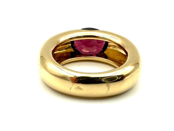 Bague 51 CARTIER. Collection "Ellipse", bague or jaune et grenat 58 Facettes
