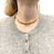 Collier Collier, "Tubogas", or jaune. 58 Facettes 34337