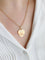 Pendentif AUGIS - Médaille amour cœur "Plus qu'hier moins que demain" or jaune rubis 58 Facettes 1128.4