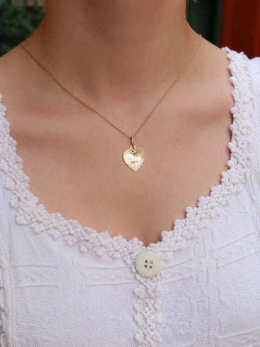 Pendentif Médaille amour Augis coeur Plus qu'hier moins que demain or jaune rubis 58 Facettes J476