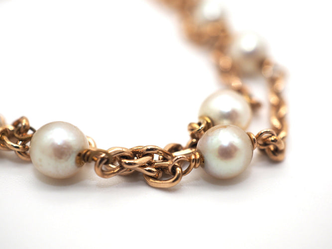 Bracelet Bracelet en or jaune et perles blanches 58 Facettes