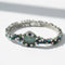 Montre Uti - Montre Ovale - Or Blanc - Diamants, Saphirs et Turquoise 58 Facettes 1.0001001/1
