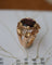 Bague 50 Bague Dôme Fleur Or Jaune et Grenat 58 Facettes A11212