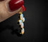 Croce Moderna con Opali Arlecchino 58 Facettes