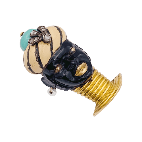 Broche Broche ancienne Cartier, "Tête de Maure", or jaune, argent, émail, diamants, turquoise. 58 Facettes 34520