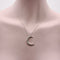 Collier Collier croissant de lune en or blanc 18 carats 58 Facettes