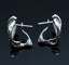 Boucles d'oreilles Boucles d'oreilles délicates serties de diamants entrelacés 58 Facettes