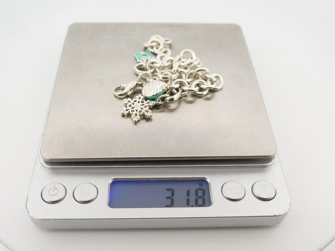 Bracelet bracelet TIFFANY & CO chaine a breloques charms argent 58 Facettes 259368