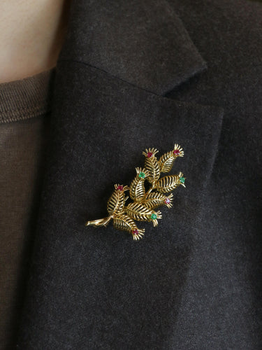 Broche GUBELIN Broche feuille or rubis émeraudes 58 Facettes 1126.1