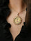 Pendentif AUGIS - Médaille amour arabesques plus qu'hier moins que demain or jaune, rubis 58 Facettes J557